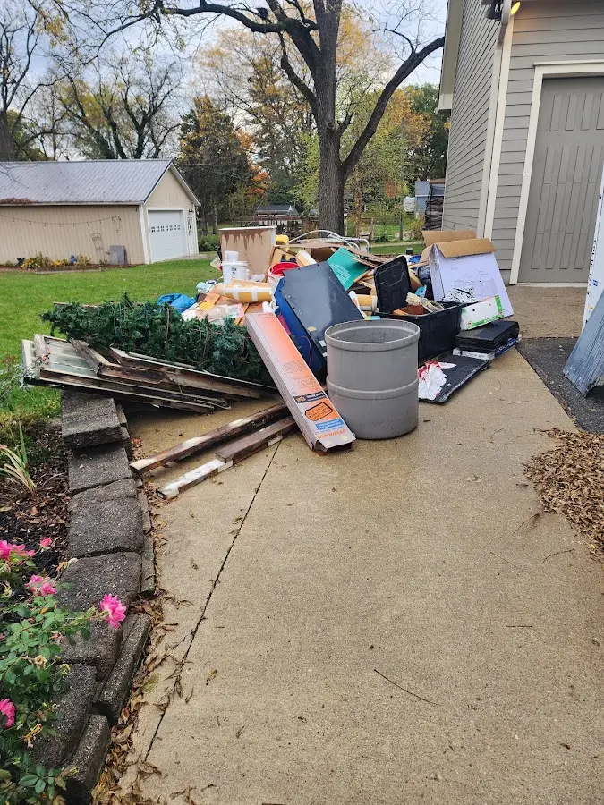 Dumpster being loaded with debris for Commercial Dumpster Rental in Shelbyville